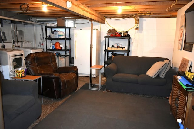 unfinished basement with freestanding refrigerator