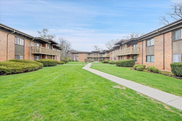 surrounding community featuring a residential view and a lawn