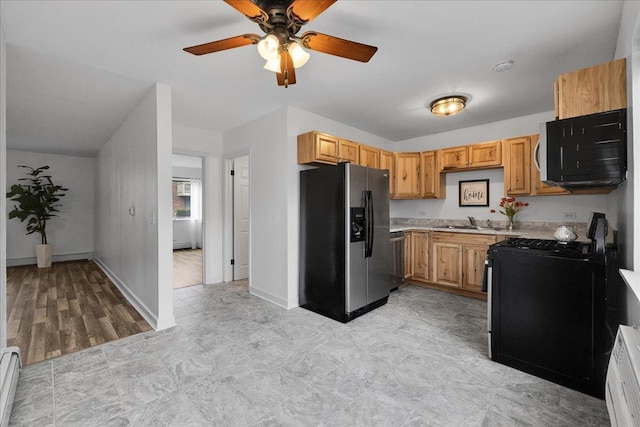 kitchen with gas stove, a baseboard radiator, light countertops, fridge with ice dispenser, and a sink