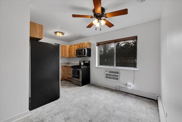 kitchen featuring appliances with stainless steel finishes, baseboard heating, a wall mounted AC, baseboards, and a ceiling fan