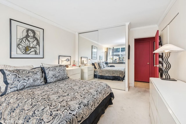 1555 N Sandburg Ter Unit 115K, Chicago, IL 60610 - bedroom with crown molding, a closet, and light colored carpet