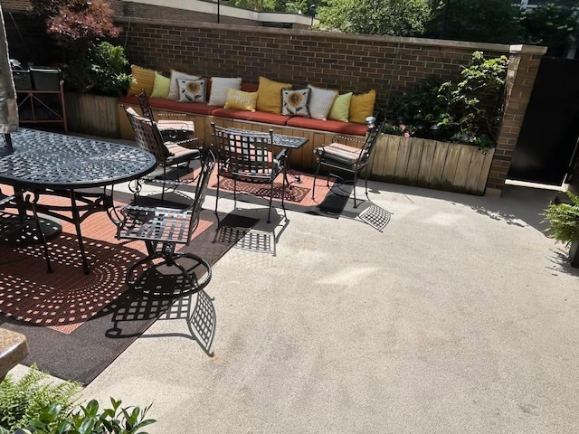 1555 N Sandburg Ter Unit 115K, Chicago, IL 60610 - view of patio / terrace featuring outdoor dining space