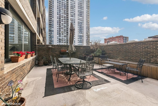 1555 N Sandburg Ter Unit 115K, Chicago, IL 60610 - view of patio / terrace with outdoor dining area