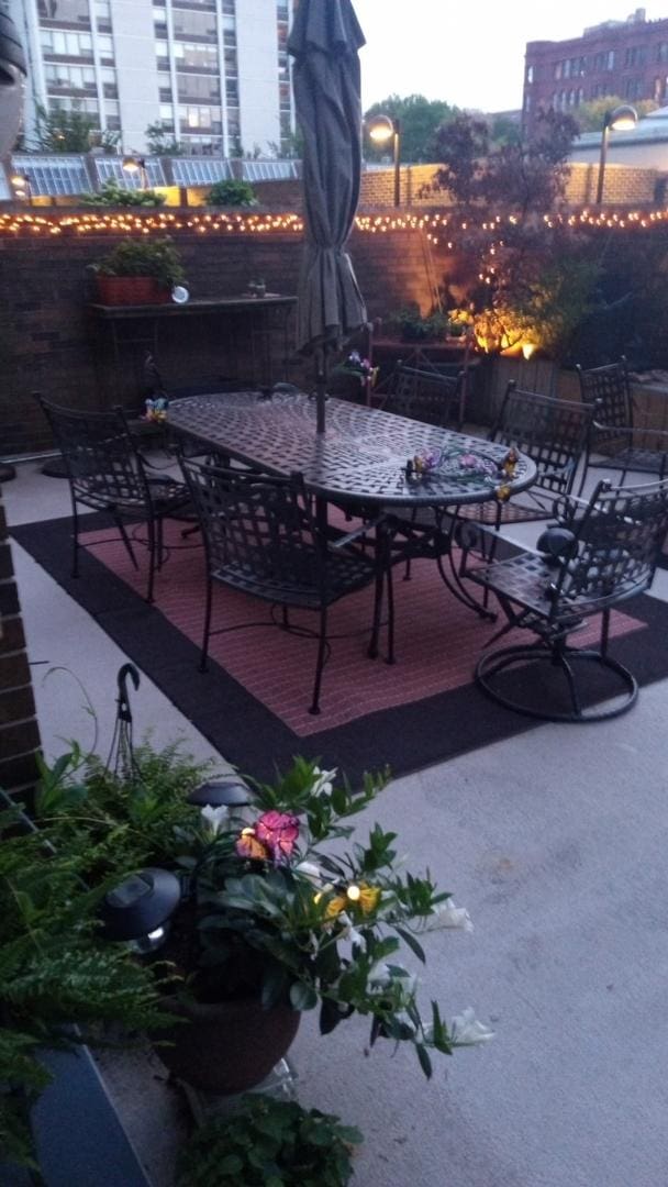 1555 N Sandburg Ter Unit 115K, Chicago, IL 60610 - view of patio featuring outdoor dining space