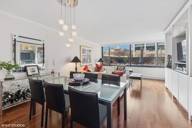 1555 N Sandburg Ter Unit 115K, Chicago, IL 60610 - dining room featuring ornamental molding and wood finished floors