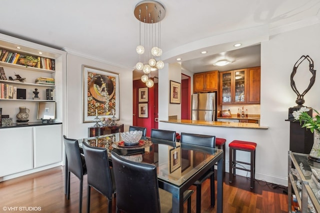 1555 N Sandburg Ter Unit 115K, Chicago, IL 60610 - dining area with indoor wet bar, wood finished floors, recessed lighting, and ornamental molding