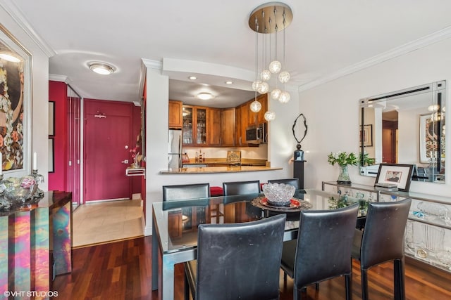 1555 N Sandburg Ter Unit 115K, Chicago, IL 60610 - dining space featuring crown molding and dark wood-style floors