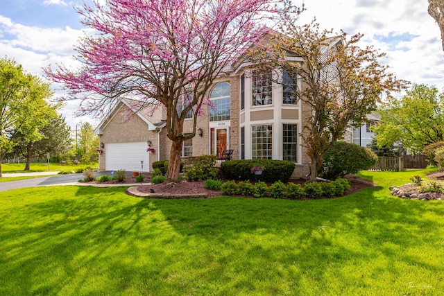 view of front of property featuring asphalt driveway and brick siding