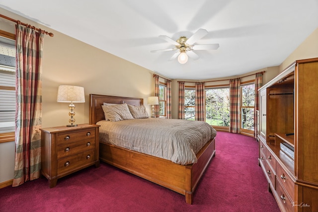 bedroom with dark carpet and ceiling fan