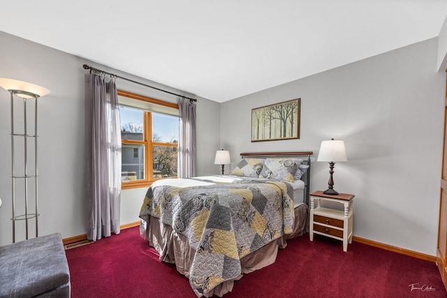 bedroom with carpet flooring and baseboards