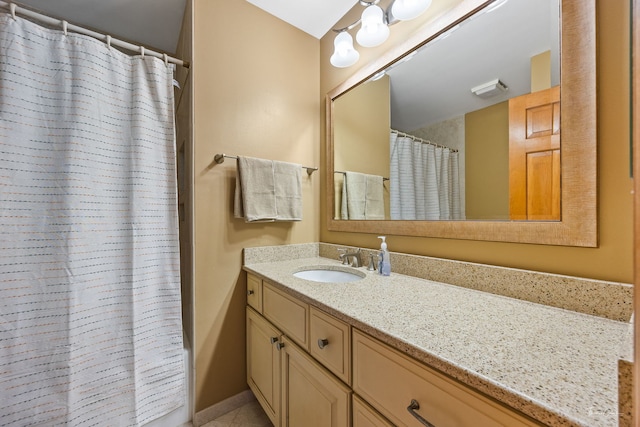 bathroom with vanity and a shower with shower curtain