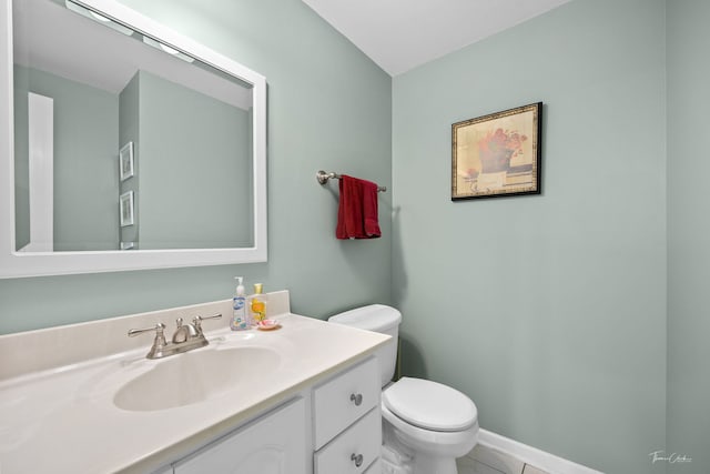 half bath featuring toilet and vanity