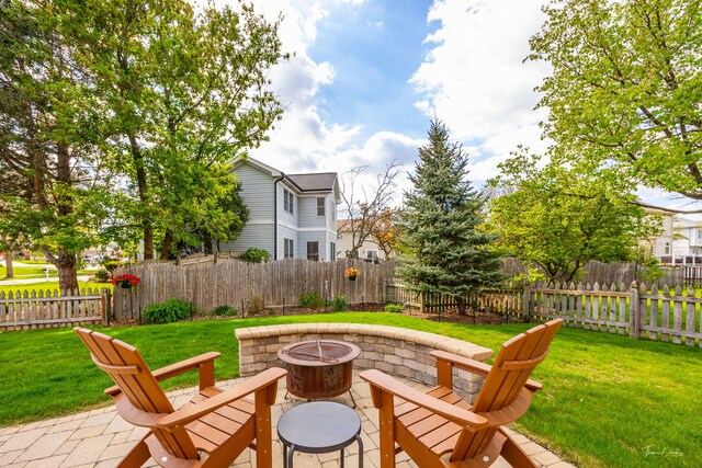 view of yard with a fire pit and a patio area