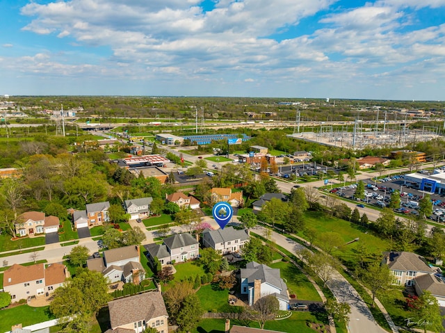 view of property location featuring a tree filled landscape