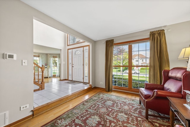 entryway with wood finished floors and baseboards