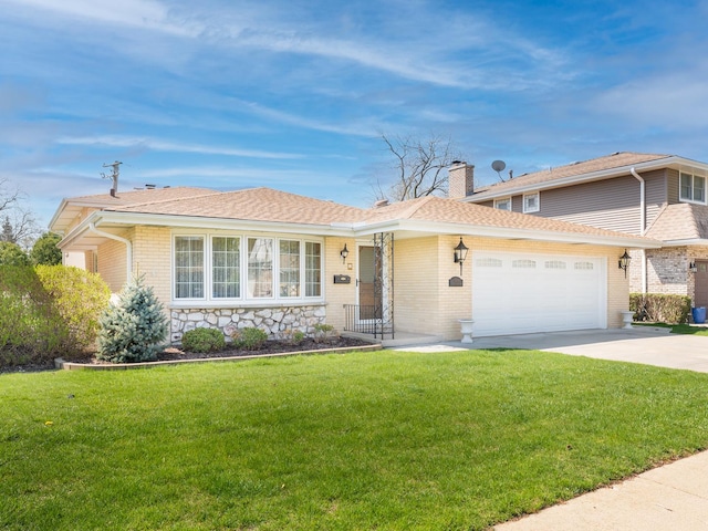 view of front of home featuring roof with shingles, an attached garage, a front lawn, a chimney, and driveway