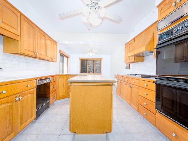 kitchen featuring light countertops, a ceiling fan, backsplash, a kitchen island, and black appliances