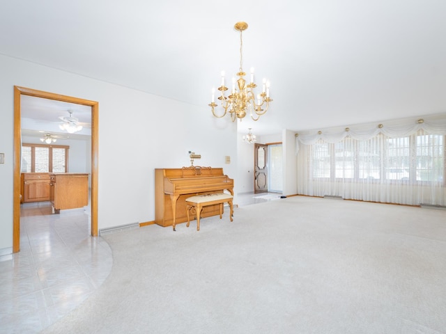 interior space featuring an inviting chandelier, baseboards, and a wealth of natural light