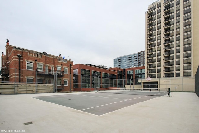 view of tennis court with fence