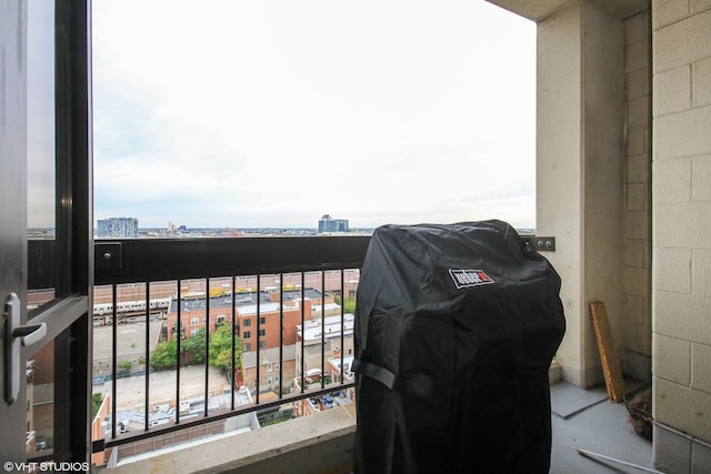balcony with a grill and a view of city