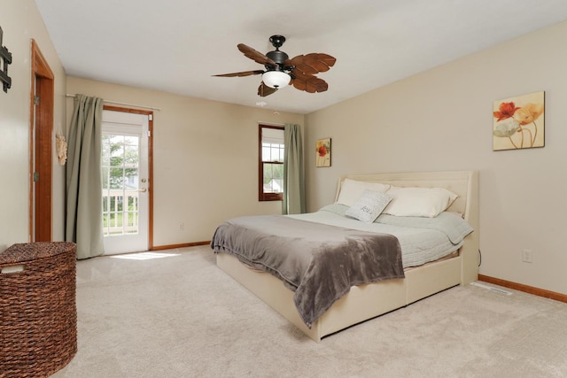 carpeted bedroom featuring baseboards and ceiling fan