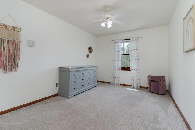 bedroom featuring a ceiling fan, baseboards, and light colored carpet
