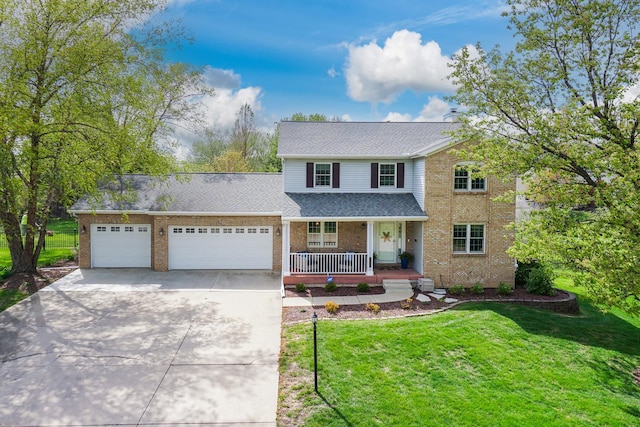 traditional-style house featuring covered porch, a front yard, brick siding, an attached garage, and driveway
