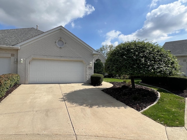16313 Chickadee Cir, Orland Park, IL 60467 - view of property exterior with driveway, roof with shingles, a garage, and brick siding
