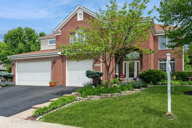 38W424 Berquist Dr, Geneva, IL 60134 - view of front facade with an attached garage, asphalt driveway, a front lawn, and brick siding