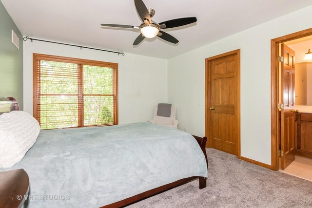 38W424 Berquist Dr, Geneva, IL 60134 - bedroom featuring light colored carpet, connected bathroom, and ceiling fan