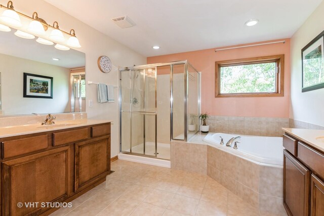 38W424 Berquist Dr, Geneva, IL 60134 - bathroom featuring vanity, healthy amount of natural light, a stall shower, and recessed lighting