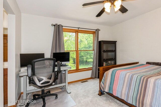 38W424 Berquist Dr, Geneva, IL 60134 - carpeted bedroom with baseboards, an office area, and a ceiling fan