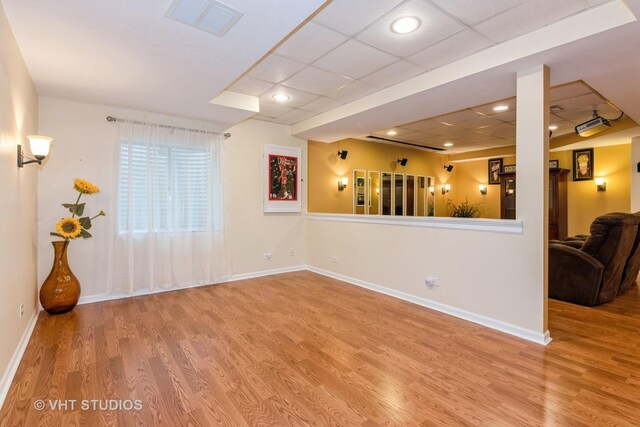38W424 Berquist Dr, Geneva, IL 60134 - unfurnished room featuring wood finished floors, a drop ceiling, baseboards, and recessed lighting