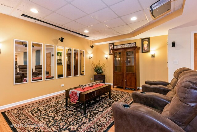 38W424 Berquist Dr, Geneva, IL 60134 - living room featuring a drop ceiling, recessed lighting, wood finished floors, and baseboards