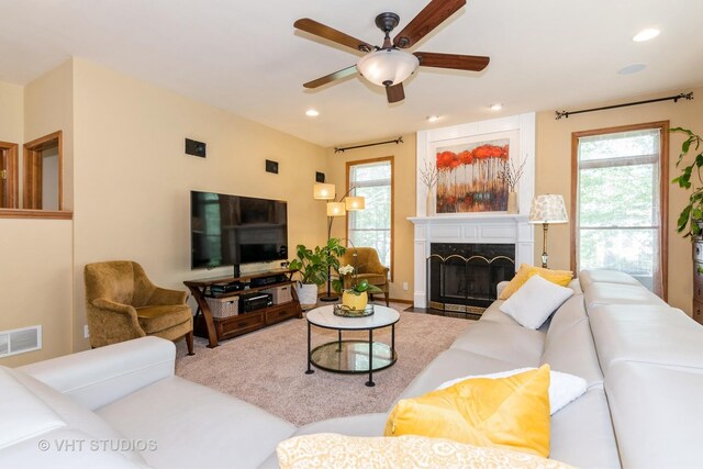 38W424 Berquist Dr, Geneva, IL 60134 - living area with ceiling fan, plenty of natural light, a fireplace with flush hearth, and recessed lighting
