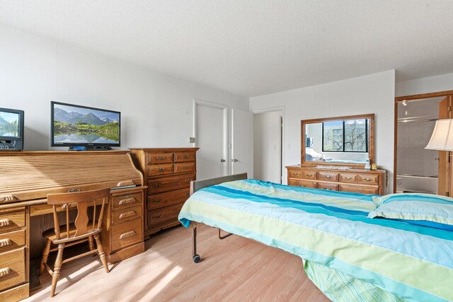 bedroom featuring light wood-type flooring