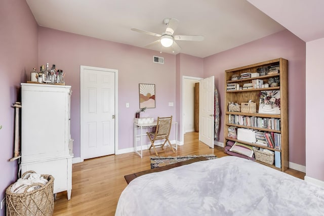 bedroom featuring visible vents, baseboards, and light wood-type flooring