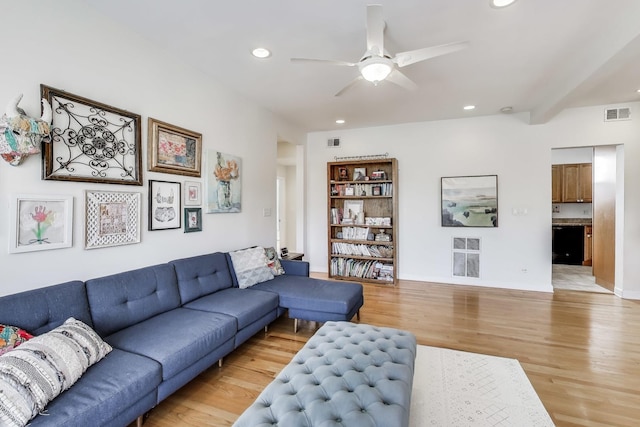 living area featuring ceiling fan, light wood finished floors, recessed lighting, and visible vents