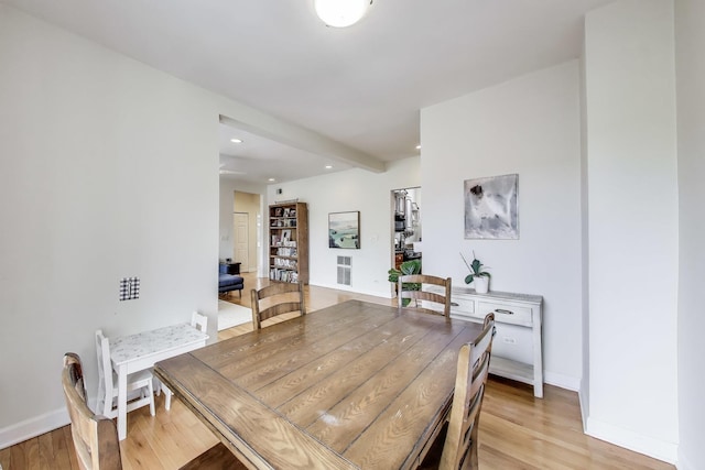 dining room featuring recessed lighting, baseboards, and light wood finished floors