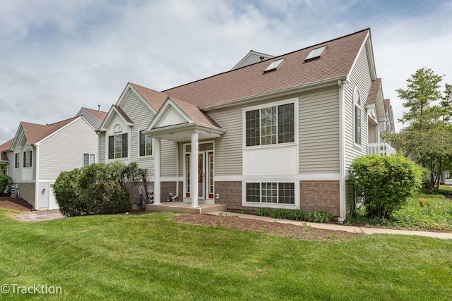 2424 Dawson Ln, Algonquin, IL 60102 - split foyer home featuring a front yard, stone siding, and a shingled roof