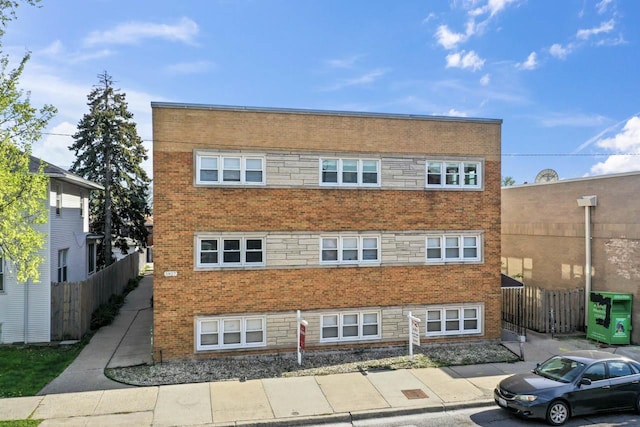 5927 W Addison St Unit 2D, Chicago, IL 60634 - view of building exterior featuring fence