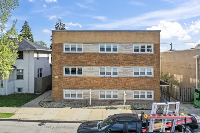 5927 W Addison St Unit 2D, Chicago, IL 60634 - view of building exterior featuring fence