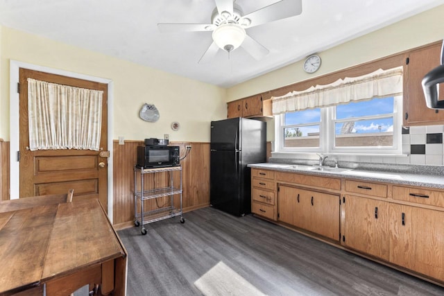 5927 W Addison St Unit 2D, Chicago, IL 60634 - kitchen featuring black appliances, a sink, dark wood finished floors, wainscoting, and a ceiling fan