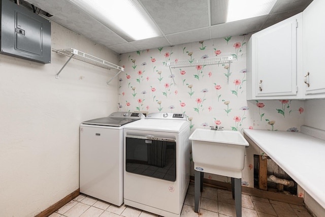 609 Moss Pl, Dixon, IL 61021 - laundry area with cabinet space, electric panel, washing machine and dryer, light tile patterned flooring, and wallpapered walls