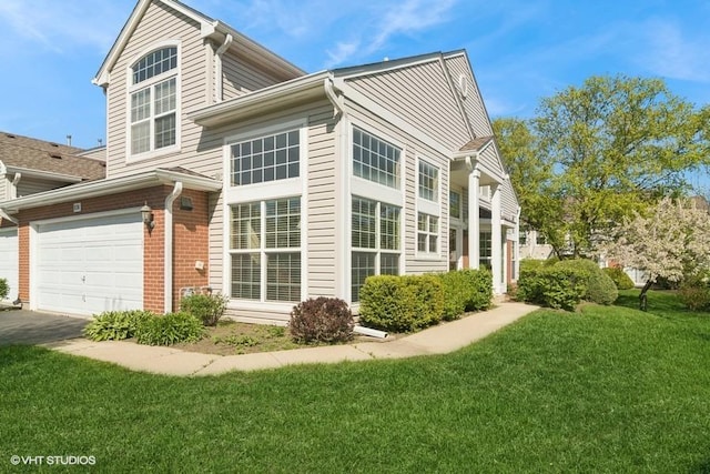 838 Old Checker Rd Unit D-4, Buffalo Grove, IL 60089 - view of side of home with a yard and asphalt driveway