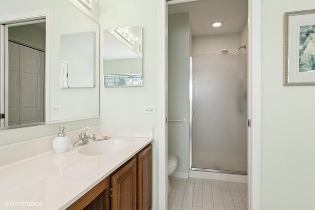 838 Old Checker Rd Unit D-4, Buffalo Grove, IL 60089 - bathroom featuring a stall shower, toilet, tile patterned flooring, vanity, and baseboards