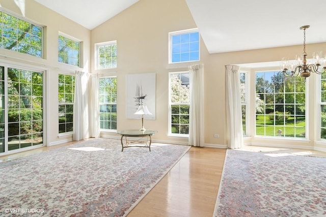 838 Old Checker Rd Unit D-4, Buffalo Grove, IL 60089 - unfurnished sunroom with a chandelier and lofted ceiling