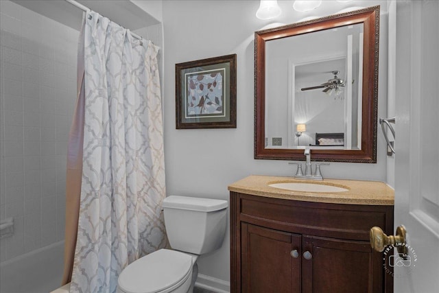 bathroom with vanity, shower / bath combo with shower curtain, and toilet