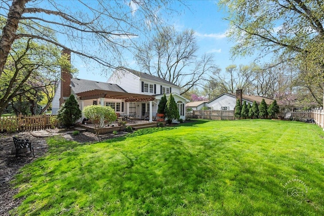 view of yard featuring a wooden deck and a fenced backyard