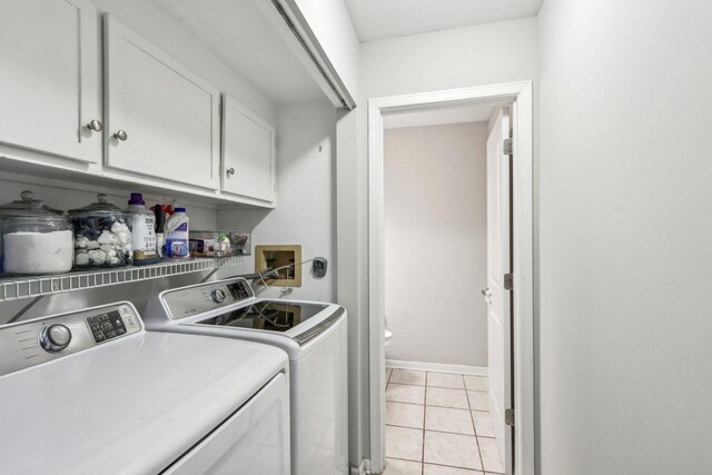 1462 Belle Haven Dr, Grayslake, IL 60030 - laundry room featuring cabinet space, washing machine and clothes dryer, and light tile patterned floors